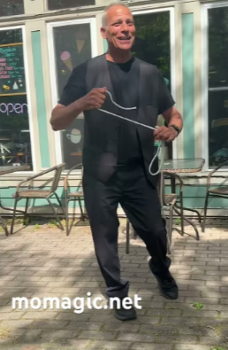 Strolling magician entertaining guests